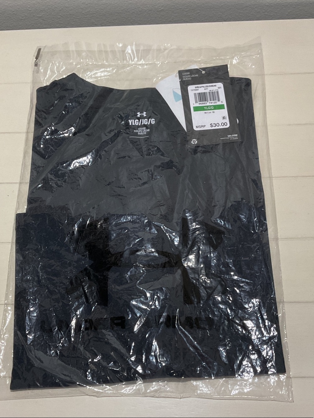 Under Armour Black Short Sleeve Youth Tee-still in manufacturing packaging